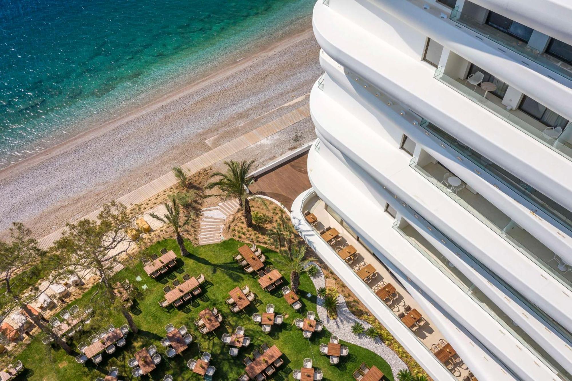 Isla Brown Corinthia Resort & Spa, Curio Collection By Hilton Agioi Theodoroi Esterno foto The beach at the hotel